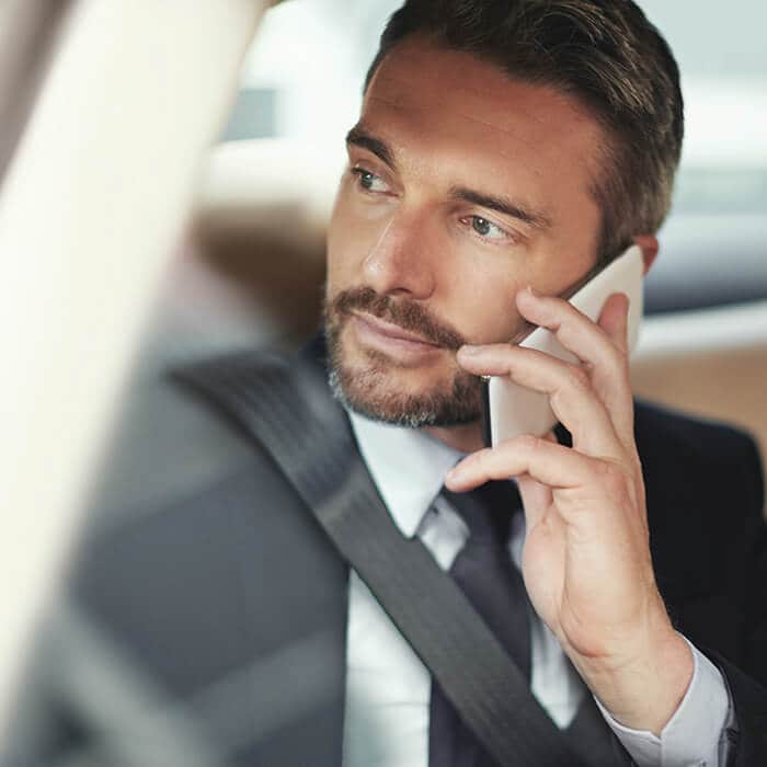 Man in car on phone