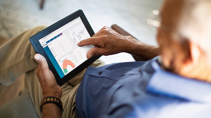 A patient inspecing their health data on a tablet