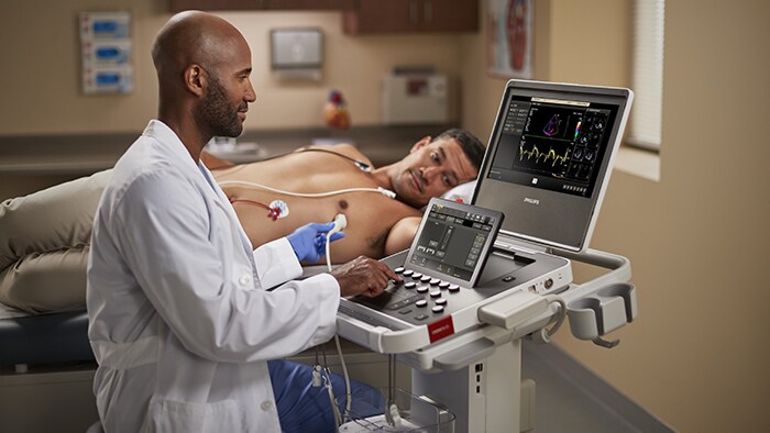 A clinician with Compact Ultrasound 5500CV and patient  